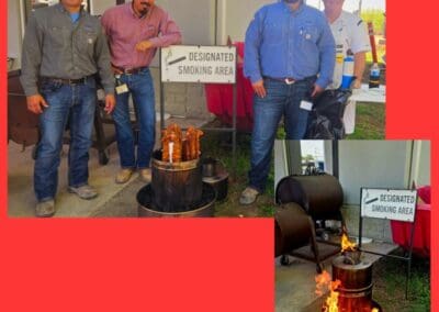 Gallery 92 Group of men near designated smoking area with fire pit and smoking barrels at Automated Dynamics.