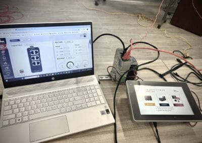 Gallery 17 Automated control system with laptop and touchscreen interface for industrial automation.