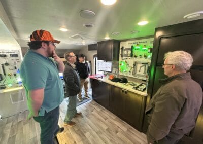 Gallery 28 Group of people viewing smart safety solutions display at Automated Dynamics Corp. gallery.