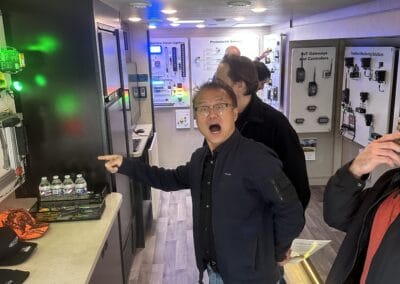 Gallery 29 Person excitedly pointing at vending machines in a tech store or exhibition.