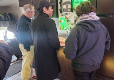 Gallery 2 Group of people examining smart safety solutions display at Automated Dynamics Corp.