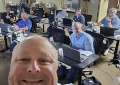Gallery 3 Group of professionals in a training session at Automated Dynamics Corp. office.